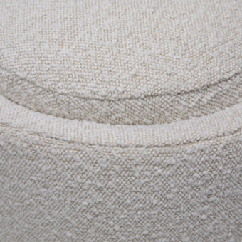 Bench by Dovetail in off-white boucle upholstery with a rounded silhouette plus horizontal channel detail throughout