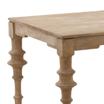 Table by Dovetail Savin in light brown grayish wood with matte textured finish, rectangular grain and spool turned legs