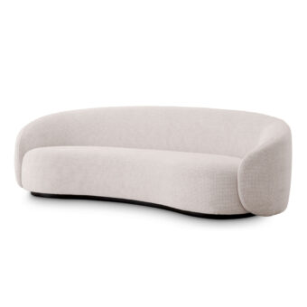 Sofa by Eichholtz in off-white fabric, featuring a crescent silhouette and black base