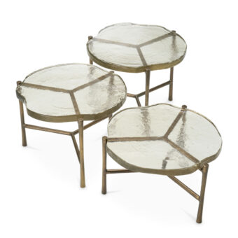 Coffee table set by Eichholtz Baldovini featuring glass tops and metal base with vintage brass finish