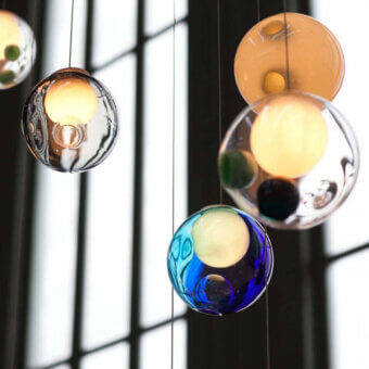 Elegant Bocci 28 Random suspension lamp with clear glass exterior and milk white interior offering a glossy finish