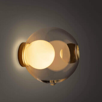Superior Bocci 28s lamp crafted in clear glass with a milk white interior and polished brass mounting bracket