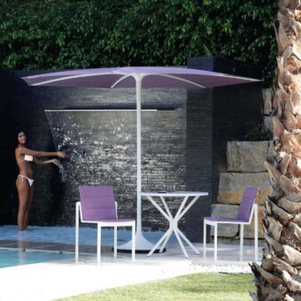 Innovative Royal Botania Palma umbrella with cantilevered form and muted lavender textile canopy in a smooth matte finish