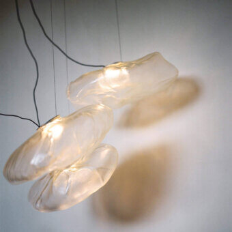 Exceptional Bocci 73 sculptural cable suspension lamp in warm amber translucent blown glass with brushed nickel canopy