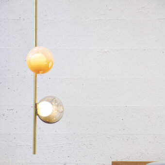 Elegant Bocci 28 Stem Ceiling Lamp with gradient pale orange to clear glass spheres and brass finish
