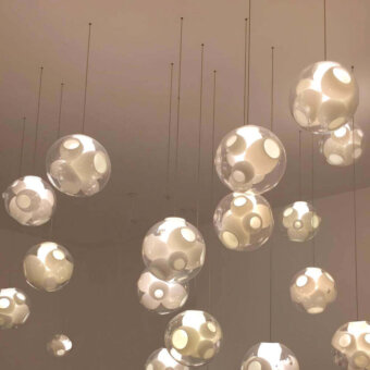 Captivating Bocci 38V Single Suspension Lamp lighting fixture crafted in clear glass with milk white interior cavities