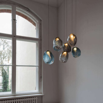 Captivating Bocci 73V single suspension lamp crafted in molten glass with blue gradient and brushed nickel canopy