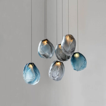 Distinguished Bocci 73V suspension lamp with a tear-drop silhouette crafted from textured glass and braided metal coaxial cable in brushed nickel