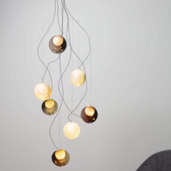 Exceptional Bocci 28 sculptural lamp with hand-blown glass pendants in gold, amber, and pale yellow tones with slender black cables