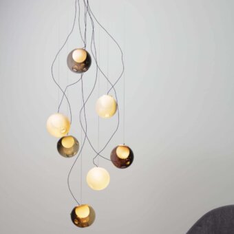 Exceptional Bocci 28 sculptural lamp with hand-blown glass pendants in gold, amber, and pale yellow tones with slender black cables