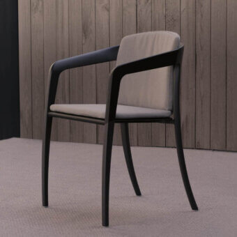 Elegant Royal Botania Jive armchair with woven olefin seat, tapered aluminum structure and light gray cushions crafted with teak armrests
