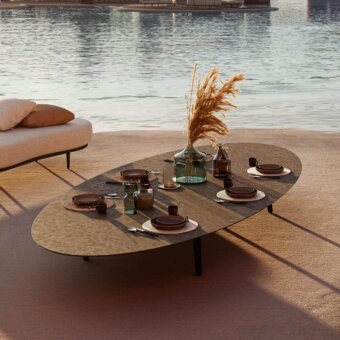 Exceptional Royal Botania Styletto coffee table with elongated oval ceramic top and dark coated aluminum legs in a matte finish