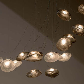 Exceptional Bocci 73 sculptural lamp with uniquely formed clear glass pendants and braided metal coaxial cables