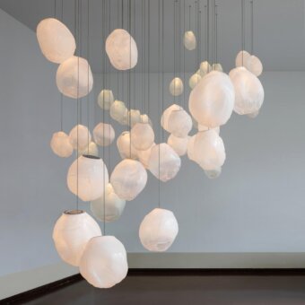 Captivating Bocci 73V suspension lamp crafted in ivory glass with a subtly wrinkled, diffused light finish