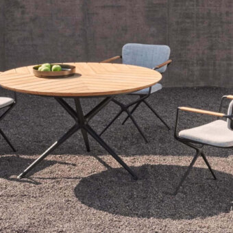 Distinguished Royal Botania Exes table with teak wood tabletop and coated aluminum star-like base showcasing a smooth radial finish