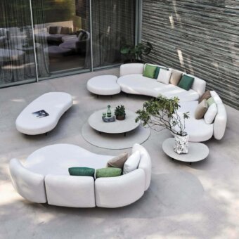 Distinguished Royal Botania Organix lounge sectional with organic shapes upholstered in matte white textile and accented with green beige pillows