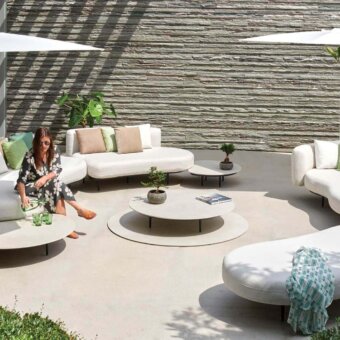 Superior Royal Botania Organix Lounge sectional with kidney shapes upholstered in white textile and calming green cushions with a dark metal base