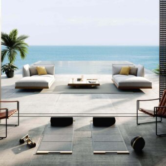 Elegant Royal Botania Strappy lounge chair with matte black coated stainless steel and medium brown eco-leather straps