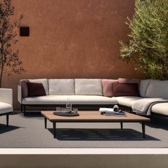 Exclusive Royal Botania Styletto lounge chair with light gray cushioned seat and dark coated aluminum frame