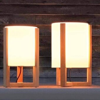 Sophisticated Royal Botania Tristar floor lamp with teak wood frame and refined smoked glass lampshade creates warm beige tones