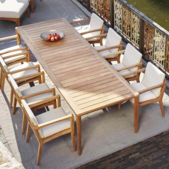 Distinguished Royal Botania U-nite table with natural light brown teak top and base exhibiting a smooth, minimalist finish