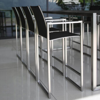 Superior Royal Botania Ninix stool with stainless steel frame and black Batyline seat and backrest exhibiting a silvery finish
