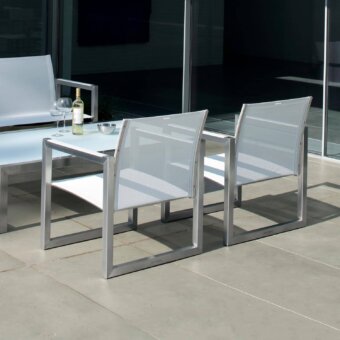 Elegant Royal Botania Ninix lounge chair with angular stainless steel frame and durable light gray Batyline seat with matte finish
