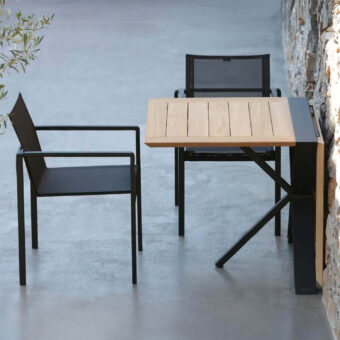 Alluring Royal Botania Alura armchair with geometric silhouette in black textured aluminum and dark seat construction