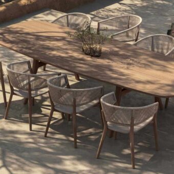 Elegant Royal Botania Zidiz dining table with teak wood frame and light beige woven seat presenting a matte finish