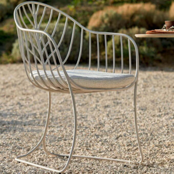 Distinctive Royal Botania Folia armchair with curved metal structure and matte finish captures attention through minimalist design