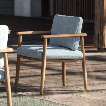 Distinguished Royal Botania Mambo armchair crafted with wood and light blue textile cushions in a smooth natural finish