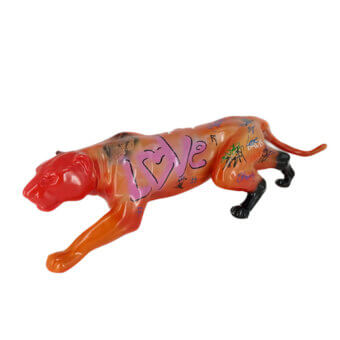 Juliarte panther sculpture in orange-red resin features black paws, tail, and vibrant graffiti markings in blue, red, black, and white.
