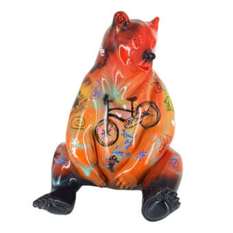 Bear sculpture, ceramic glaze, brown-orange with black base, graffiti design featuring bicycle, abstract shapes, and handwritten script.