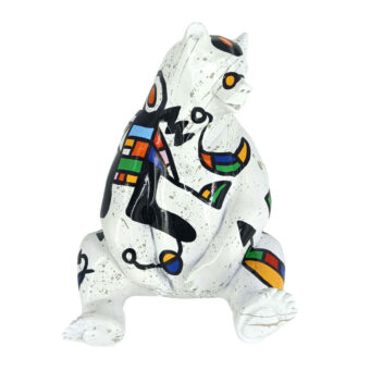 Seated bear sculpture, white ceramic, abstract Miro-style painting in black, red, yellow, blue, and green with geometric and organic shapes.