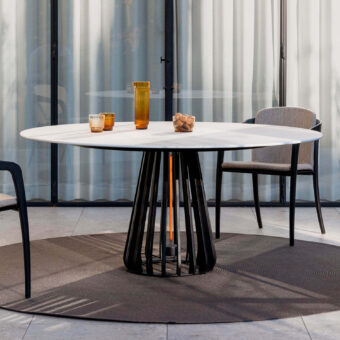 Distinguished Royal Botania Furniz table with a matte white tabletop and sculptural black metal base crafted for outdoor use