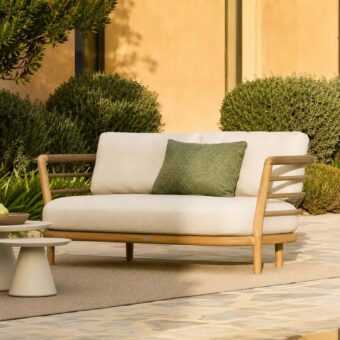 Elegant Royal Botania Archy Sofa with teak frame matte finish, off‑white textured fabric, olive‑green accent cushion presence