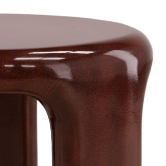 Side table by Dovetail Kevelyn crafted in brown concrete with a monolithic organic silhouette and speckled high-gloss finish