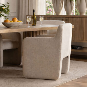 Armchair by Dovetail in off-white polyester performance fabric with matte finish, button-tufted back and integrated arms