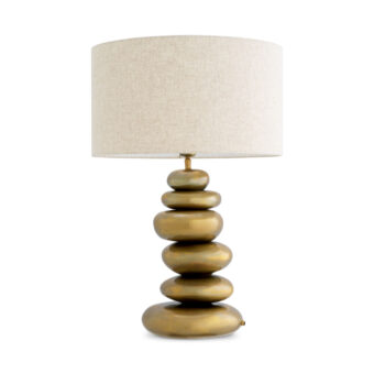 Lamp by Eichholtz featuring an off-white textile lampshade paired with a vintage brass finish metal base