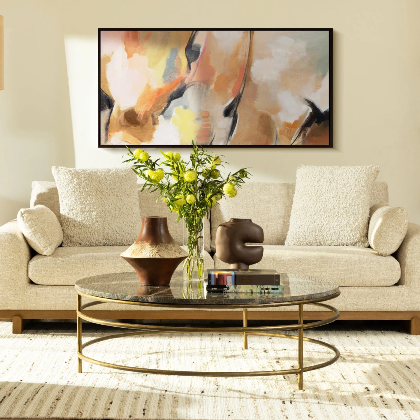Coffee table by Dovetail with polished dark green charcoal marble top on circular multi-tiered metal antique brass frame