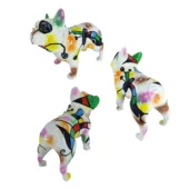Juliarte French bulldog sculptures, ceramic, cubist style; yellow, orange, green, black, and white fragmented design, asymmetrical poses.