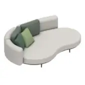 Modular sofa, light gray woven fabric, organic kidney shape with dark green-gray accent module and assorted green throw pillows on black cylindrical legs.