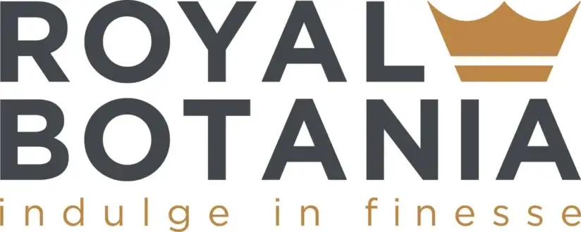 Dark gray stacked lettering spells “ROYAL BOTANIA” above smaller gray text with a small golden crown shape positioned above the letters