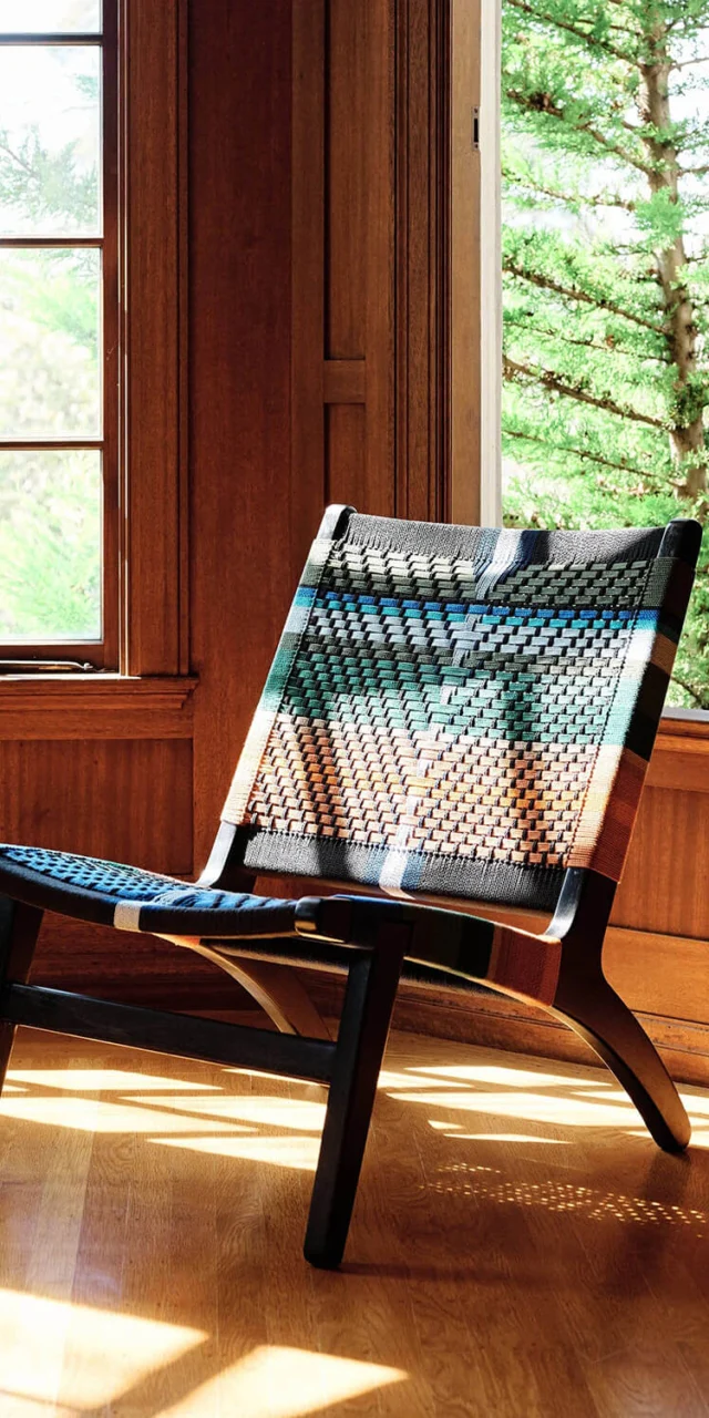 Lounge chair by MasayaCo with teak wood frame in matte finish, plus homespun polyester cord seat in black blue teal…
