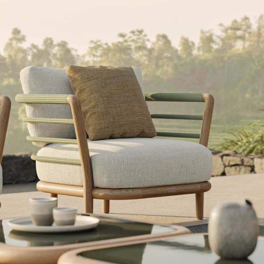 Lounge chair by Royal Botania Archy featuring natural wood frame, off-white upholstery, and olive green woven rope