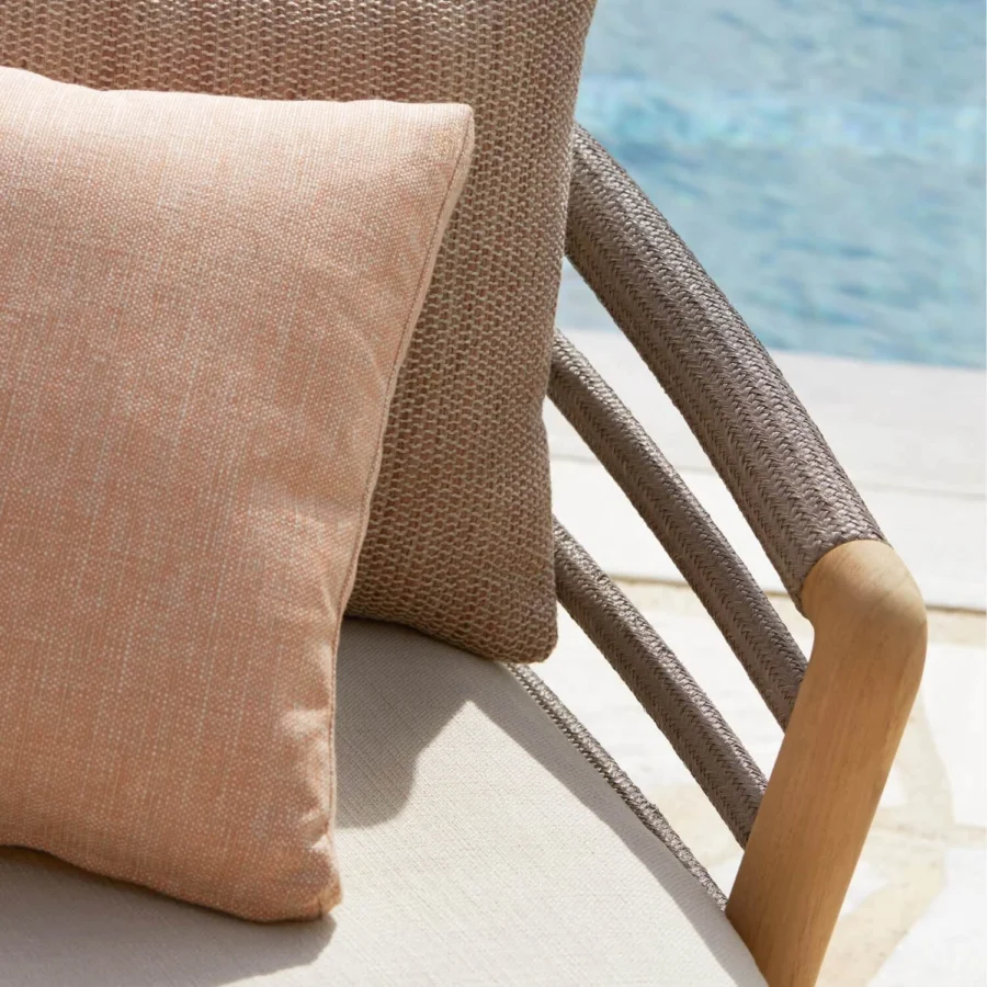 Day-bed by Royal Botania in solid teak wood with light brown finish, brownish-grey braided structure and beige upholstery