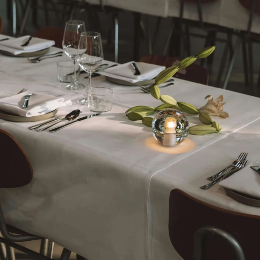 Lamp by Bocci in clear glass with frosted interior cavity and polished finish, four cordless spherical units for light