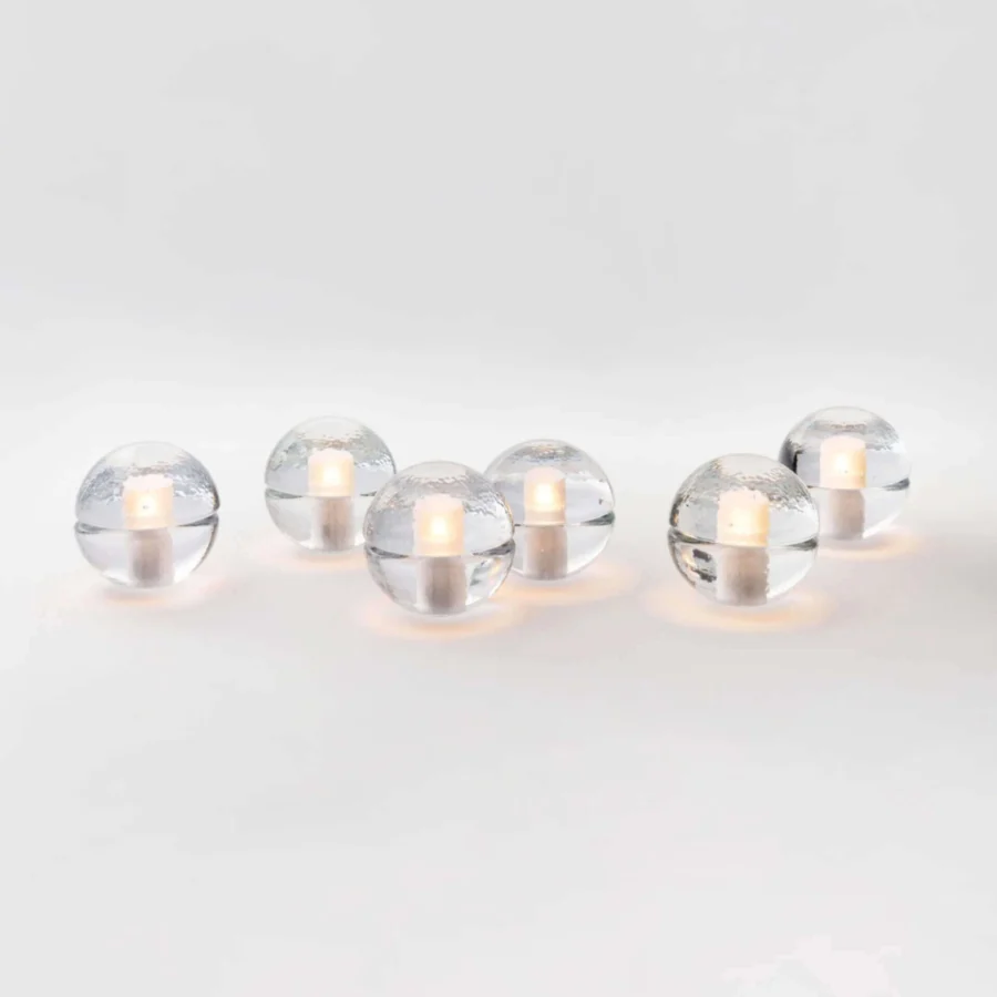 Lamp set by Bocci with four glass spheres in frosted interior cavities and clear glossy finish emitting warm white glow