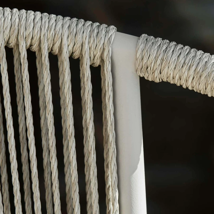 Armchair by Royal Botania featuring a stainless steel frame teak seat backrest cord detailing off-white beige finish
