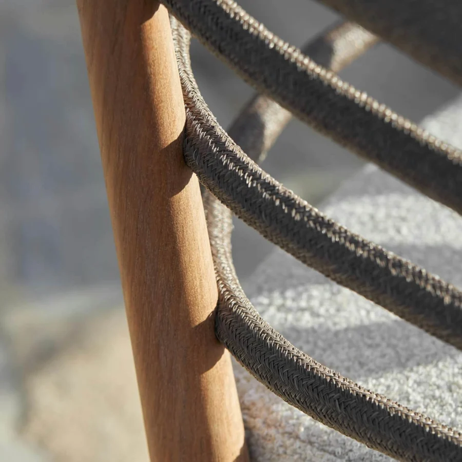 Chair by Royal Botania in solid teak wood with matte finish, dark taupe braided synthetic rope and textured light cushion